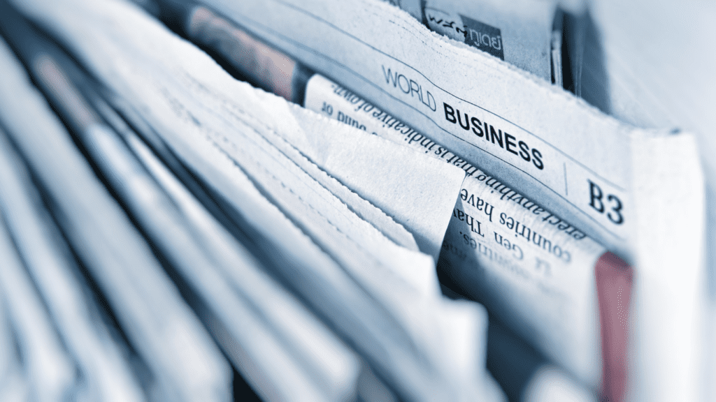 An image showing a stack of newspapers