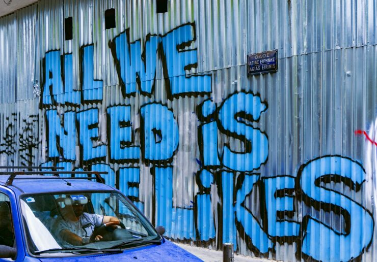 vehicle beside wall with graffiti